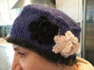 Knitted hat with knitted flowers and beading